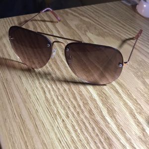 Brown and light pink oval sunglasses